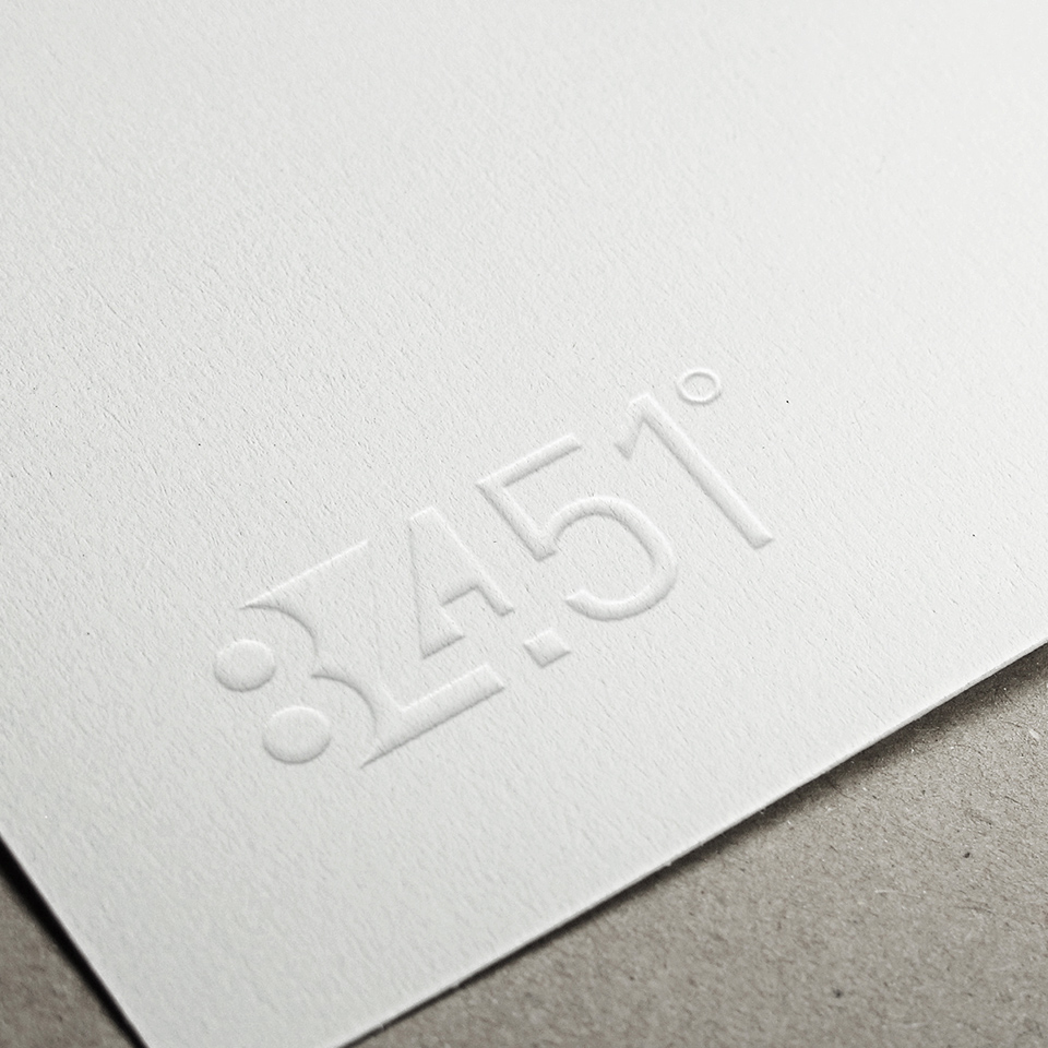 Embossed 84.51° logo on cardstock