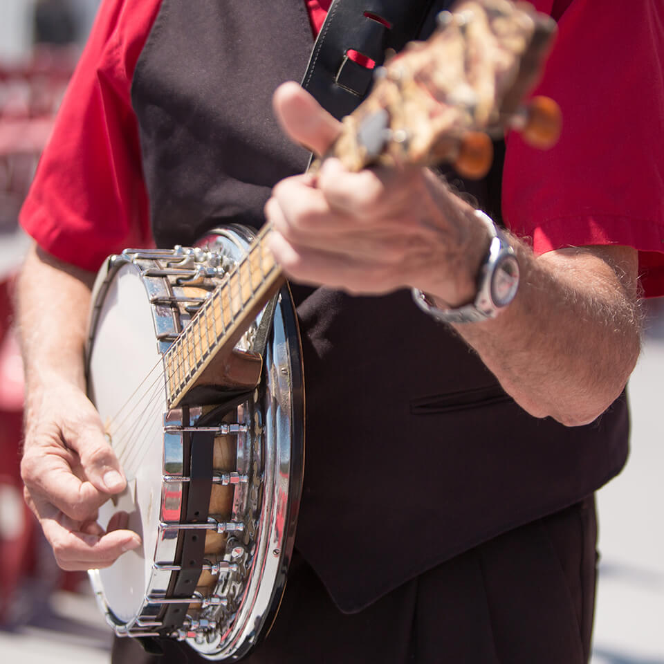 Photography work of man playing banjo