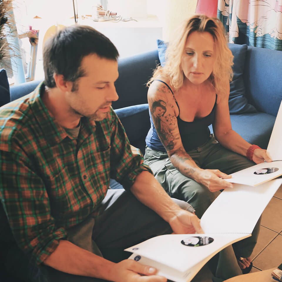 Two people planning sign designs for CoSign