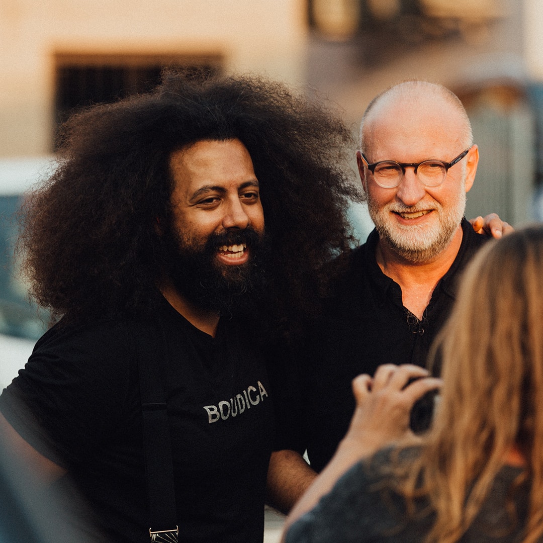Two men getting their photo taken